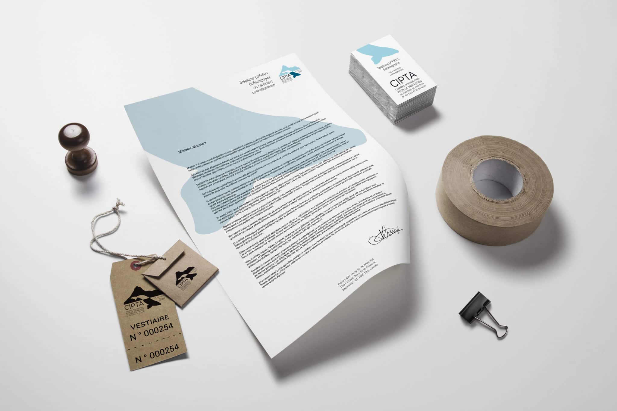 étiquettes de vestiaire avec le logo CIPTA, papier à lettre avec la baleine bleu du logo de CIPTA et cartes de visite version verticales avec la baleine de CIPTA